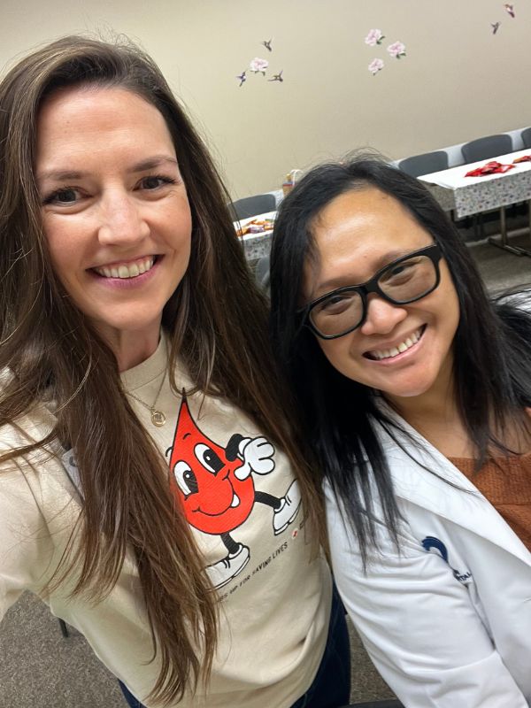 nurse practiioner and red crosser smiling together