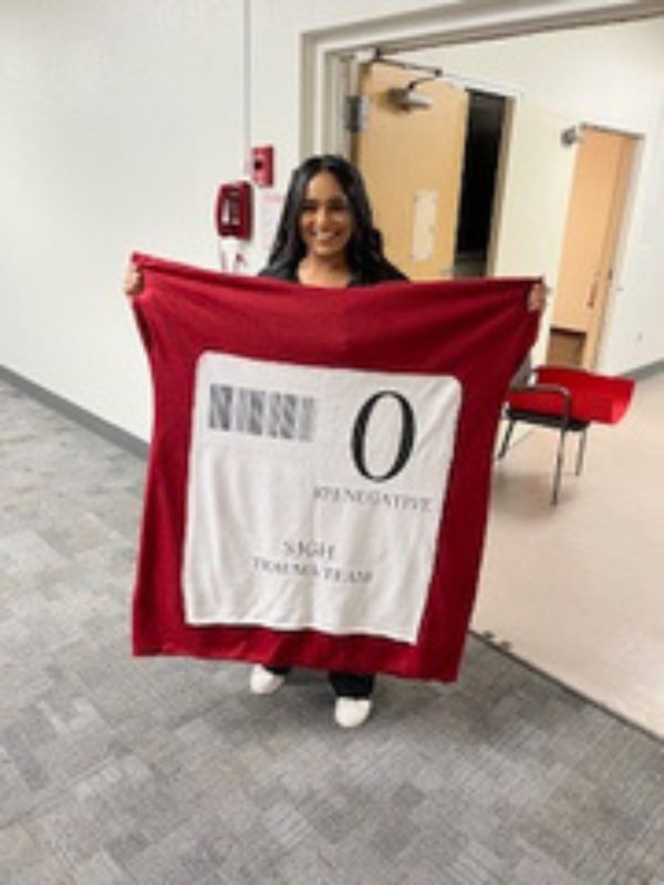 woman smiling holding blanket