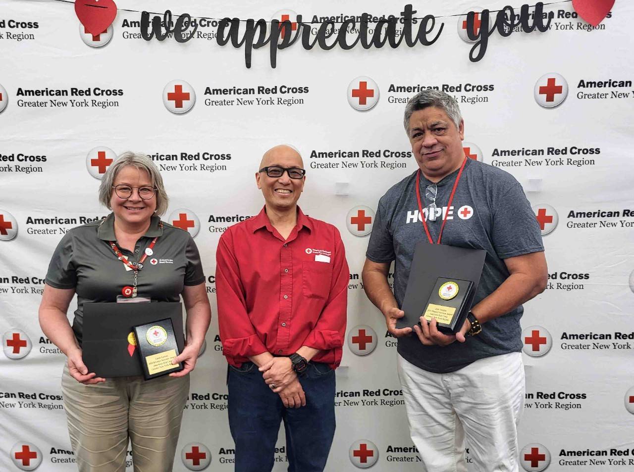 Gary Chin poses with award winners Linda Latona and Julio Medina 