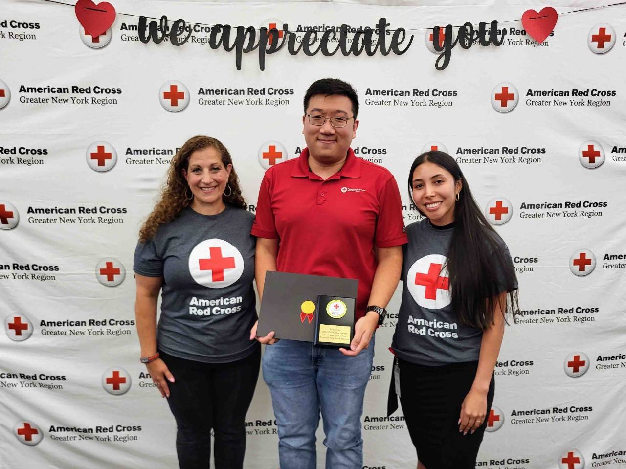 Andrea Grimaldi-Grafer and Aura Sanchez pose with award winner Bowen Yu 