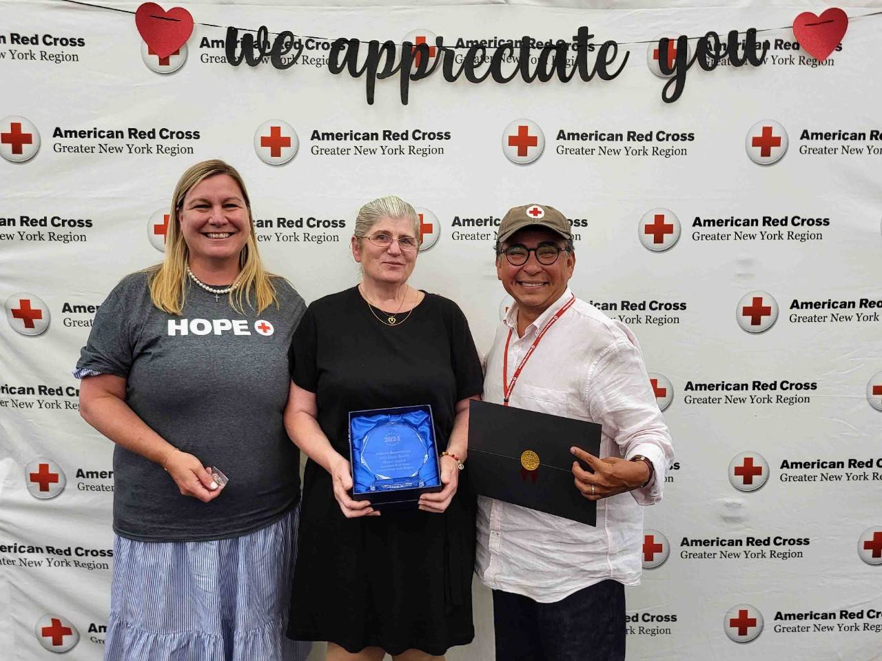 Stephanie Dunn-Ashley and Jose Dominguez pose with award winner Debora Bausen.wein