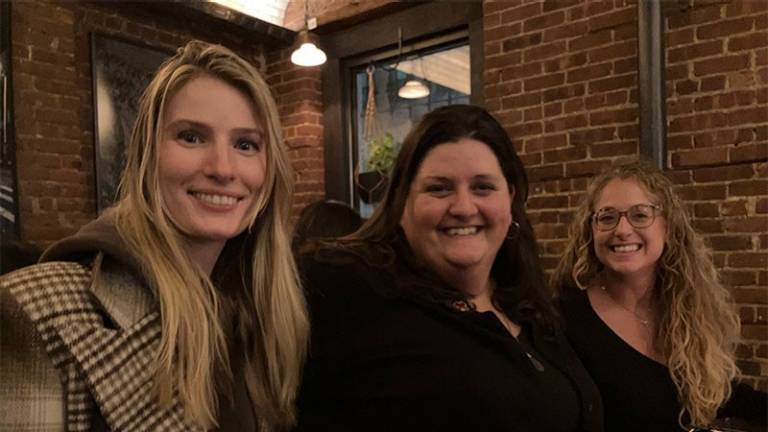 3 women smiling for camera