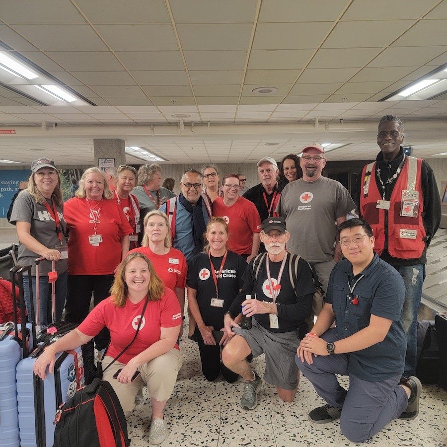Red Cross volunteers deploying to Guam at the airport