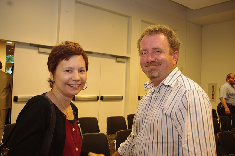 Linda Certo smiling while standing next to a man who is also smiling.