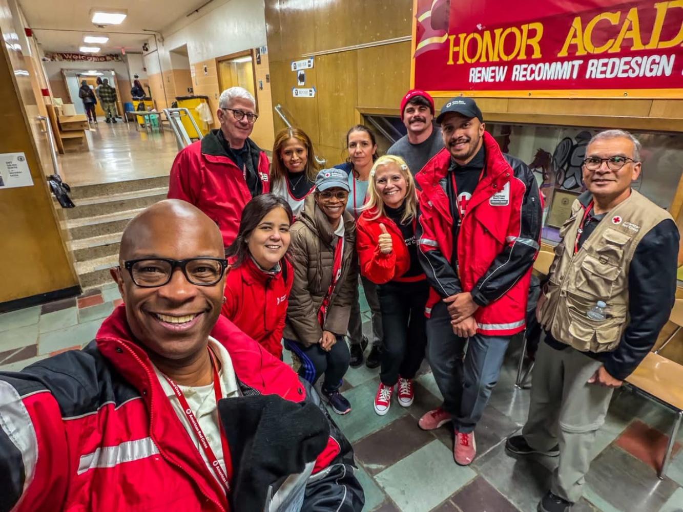 Red Cross volunteer and Mount Vernon resident Rick Gunther takes a selfie with his fellow Red Cross responders at the Holmes Elementary School where they were supporting a shelter for residents displaced by the Cottage Avenue fire.