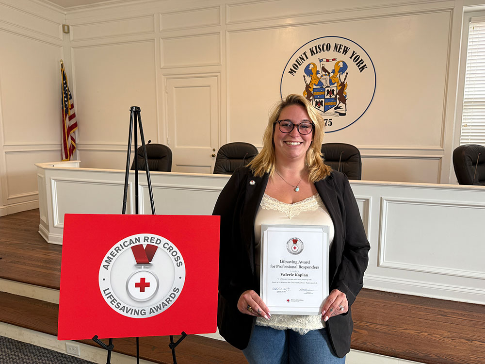 Valerie Kaplan displaying her Lifesaving Award.