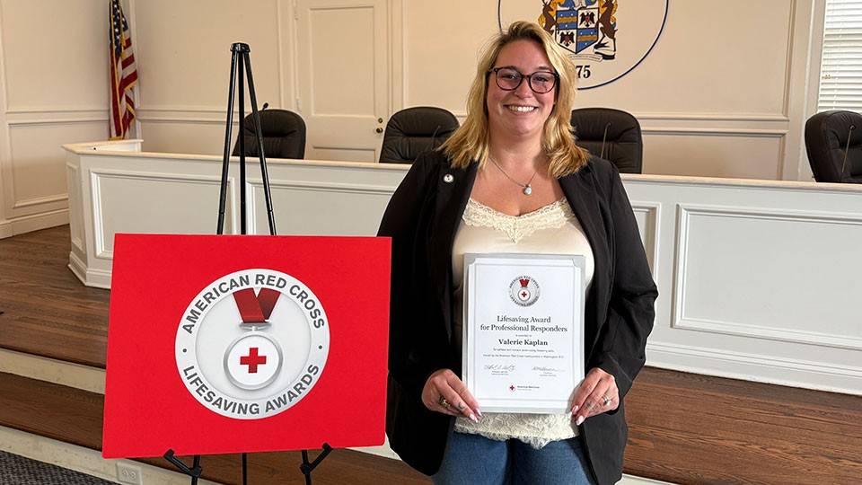 Valerie Kaplan displaying her Lifesaving Award.