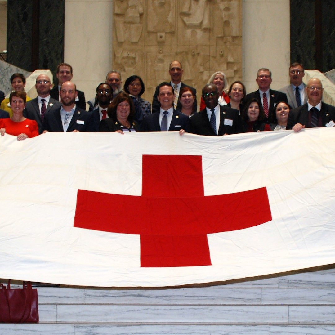 Red Cross team members on steps of Legislative Office Building in Albany New York
