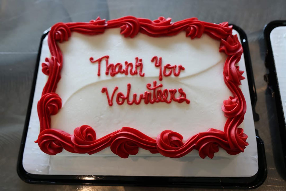 a cake with "Thank You Volunteers" written on it.