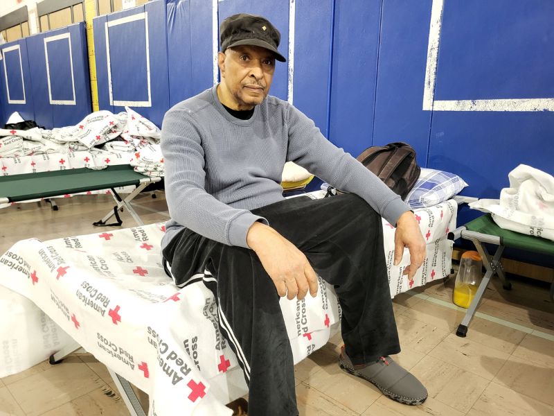 charles wilson sitting on bed in shelter
