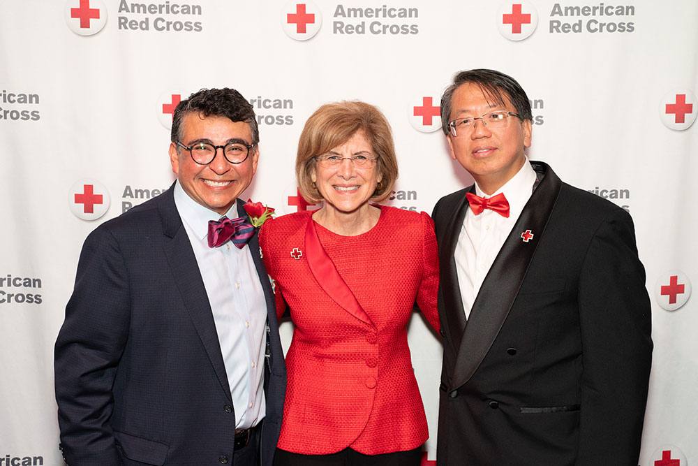 Ming Chiang, Gail McGovern and Jose Dominguez in dress clothes at annual gala for the American Red Cross.