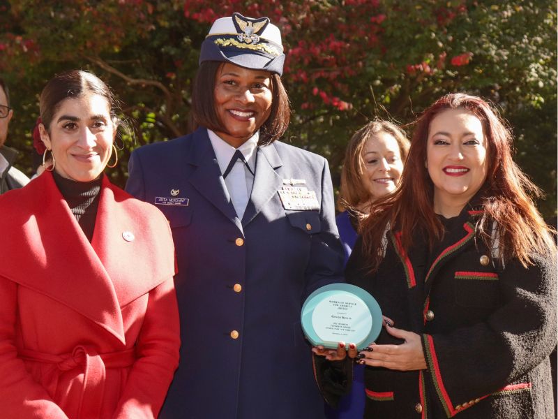 zeita merchant with ginger kelly holding award