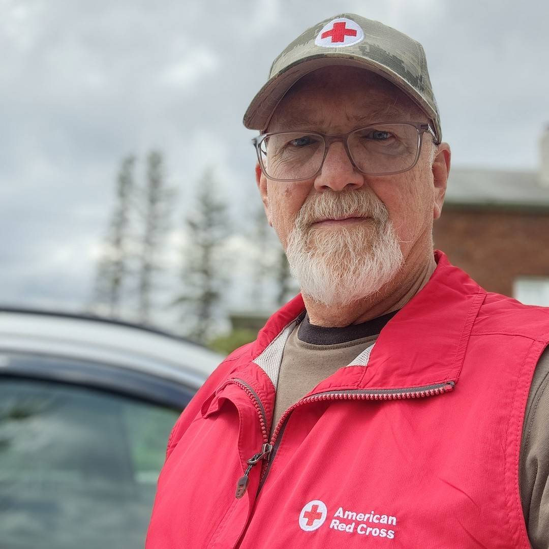 Jim Getz wearing an American Red Cross vest and hat.