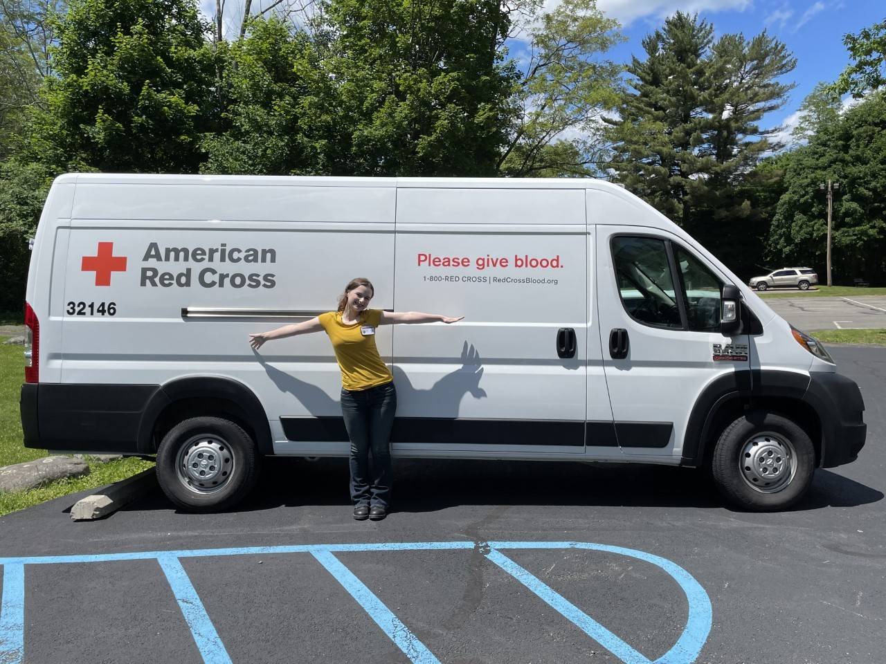 Volunteer Rhiannon Costanzo in front of ARC van