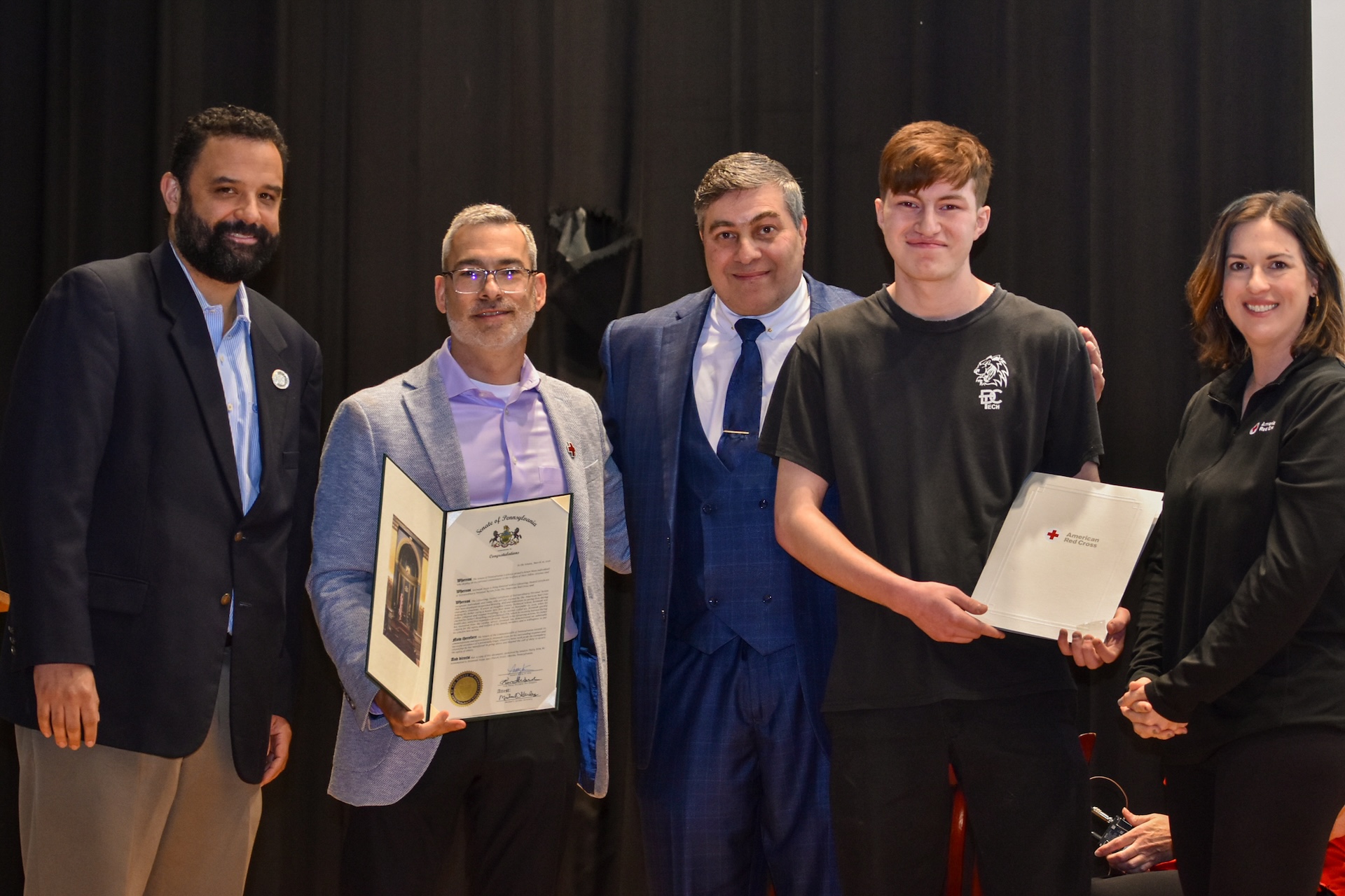 Jeremiah Stepp poses with the Certificate of Extraordinary Personal Action. From left, State Rep. Dave Madsen, Jorge Martinez, Michael Stepp, Jeremiah Stepp, Laura Burke