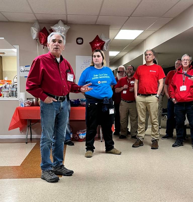 Red Cross Volunteer speaks to disaster responders