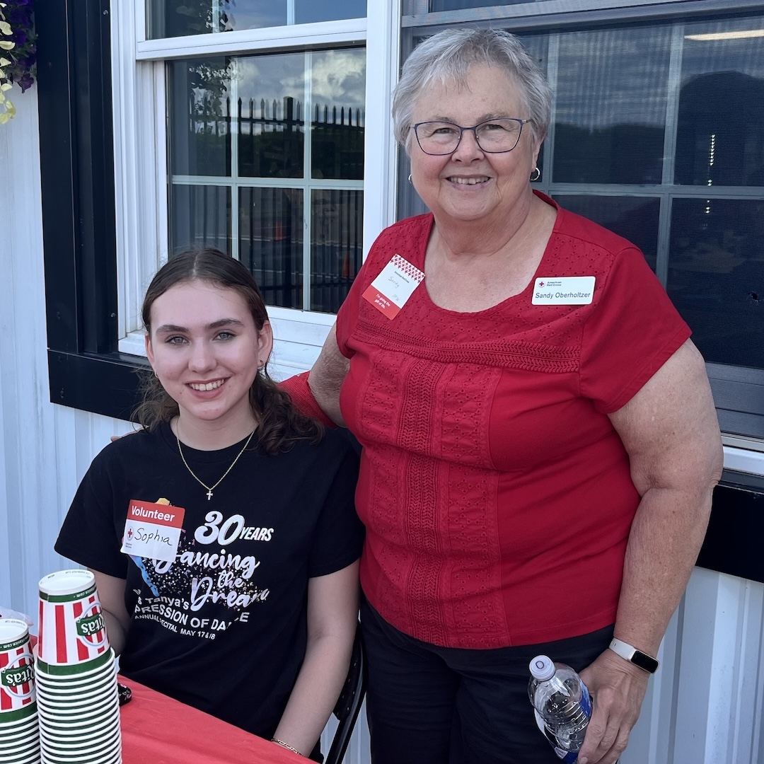 14-year-old Sophia and her grandmother Sandy Oberholtzer smile outside of Pocono Raceway Blood Drive.