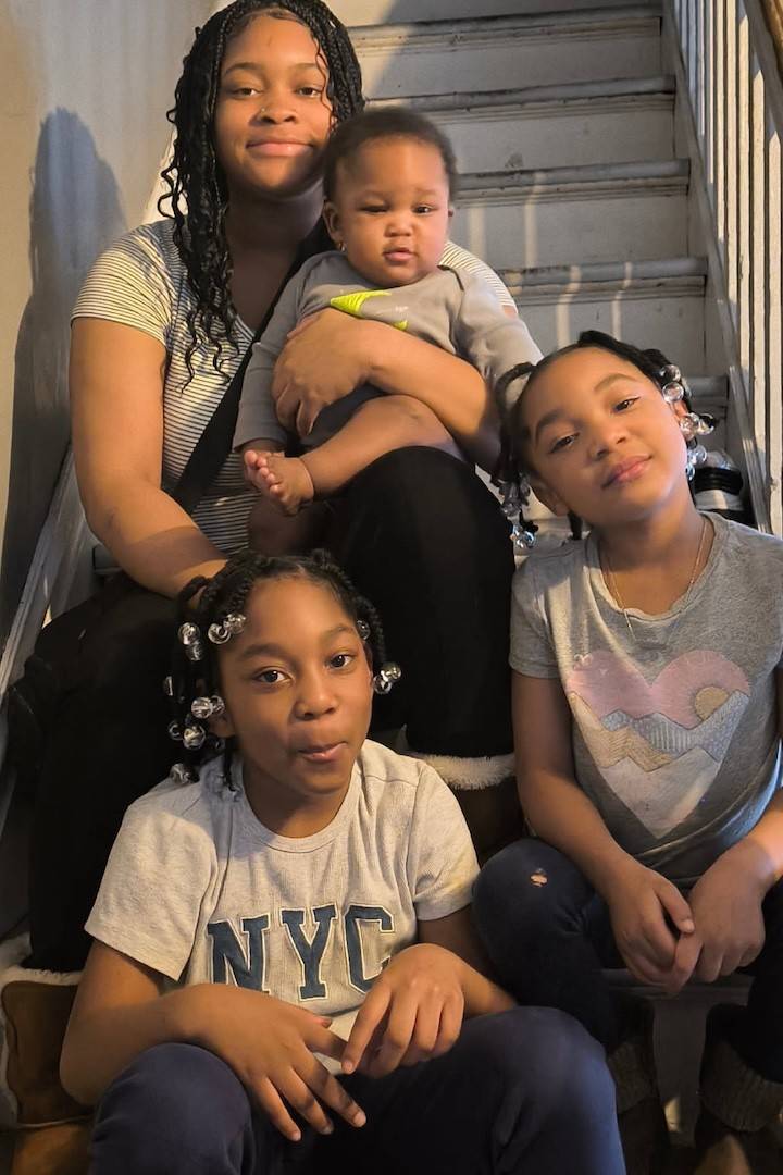 Honezty Snyder sits on stairs with siblings Rhyder, A'Laura and Nova'Lee.
