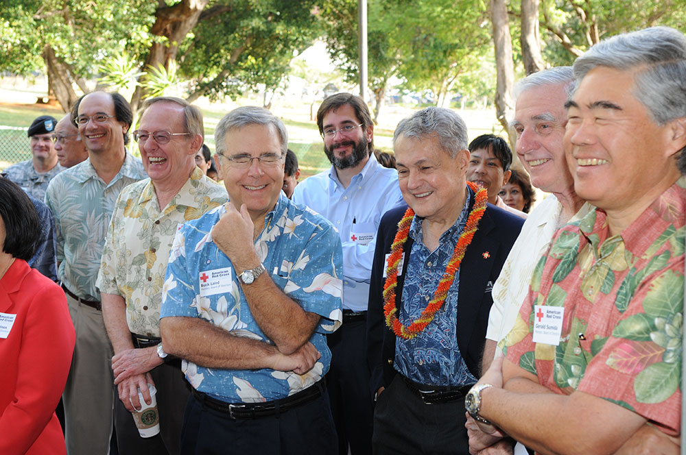 Dr. John Henry Felix outside with a group of other Red Cross employees.