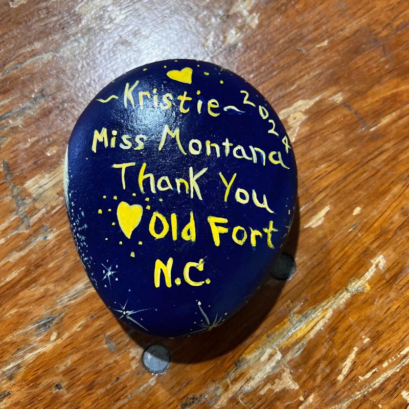 small painted round rock with message to kristie on back