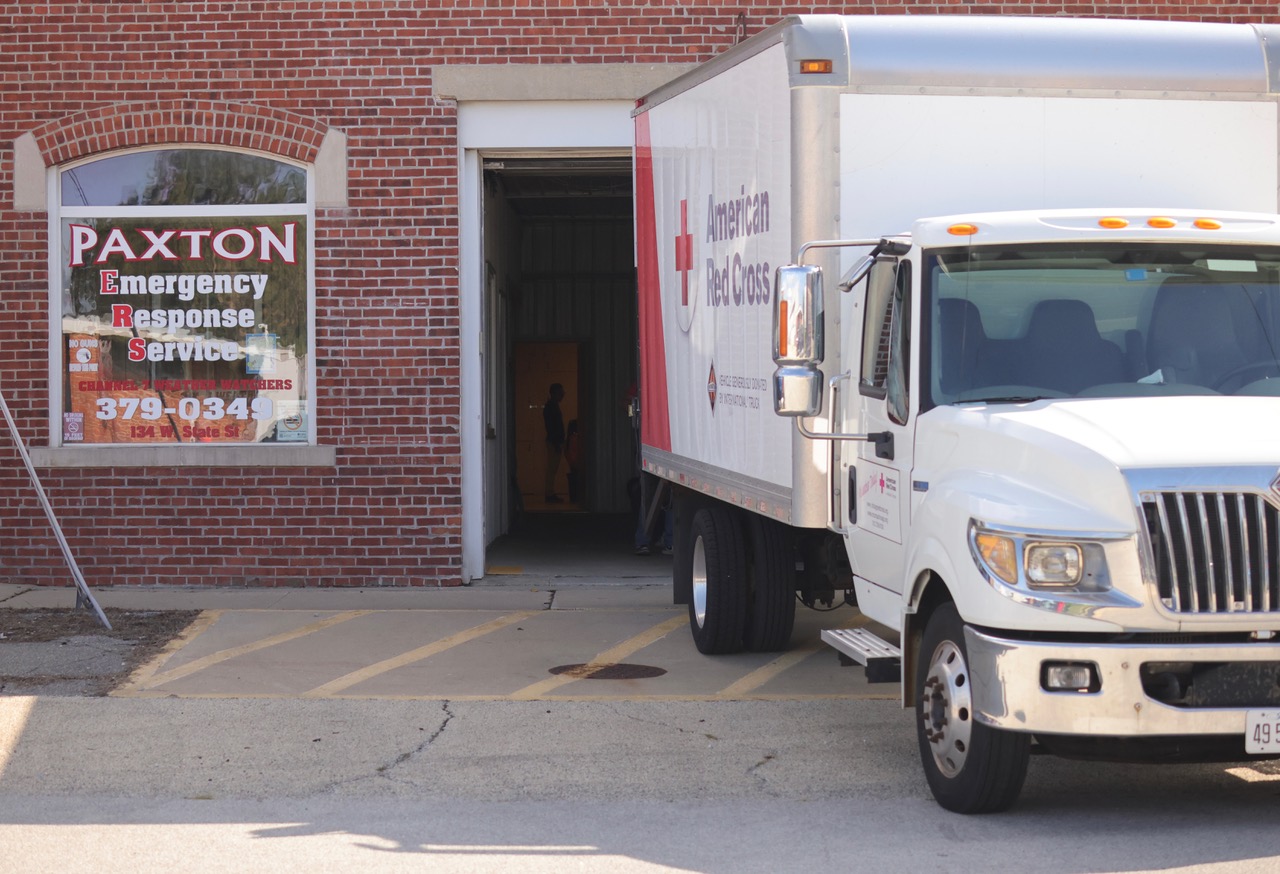 red cross vehicle parked in front of pxton emergency services building