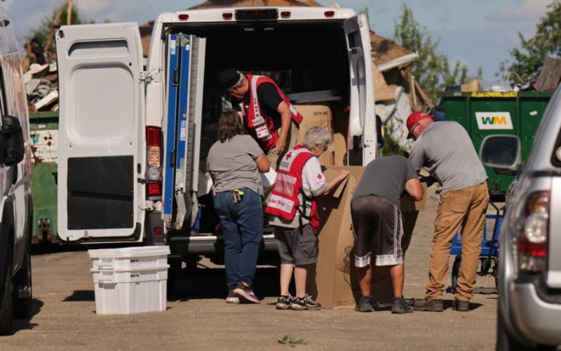 volunteers unloading disaster vehicle