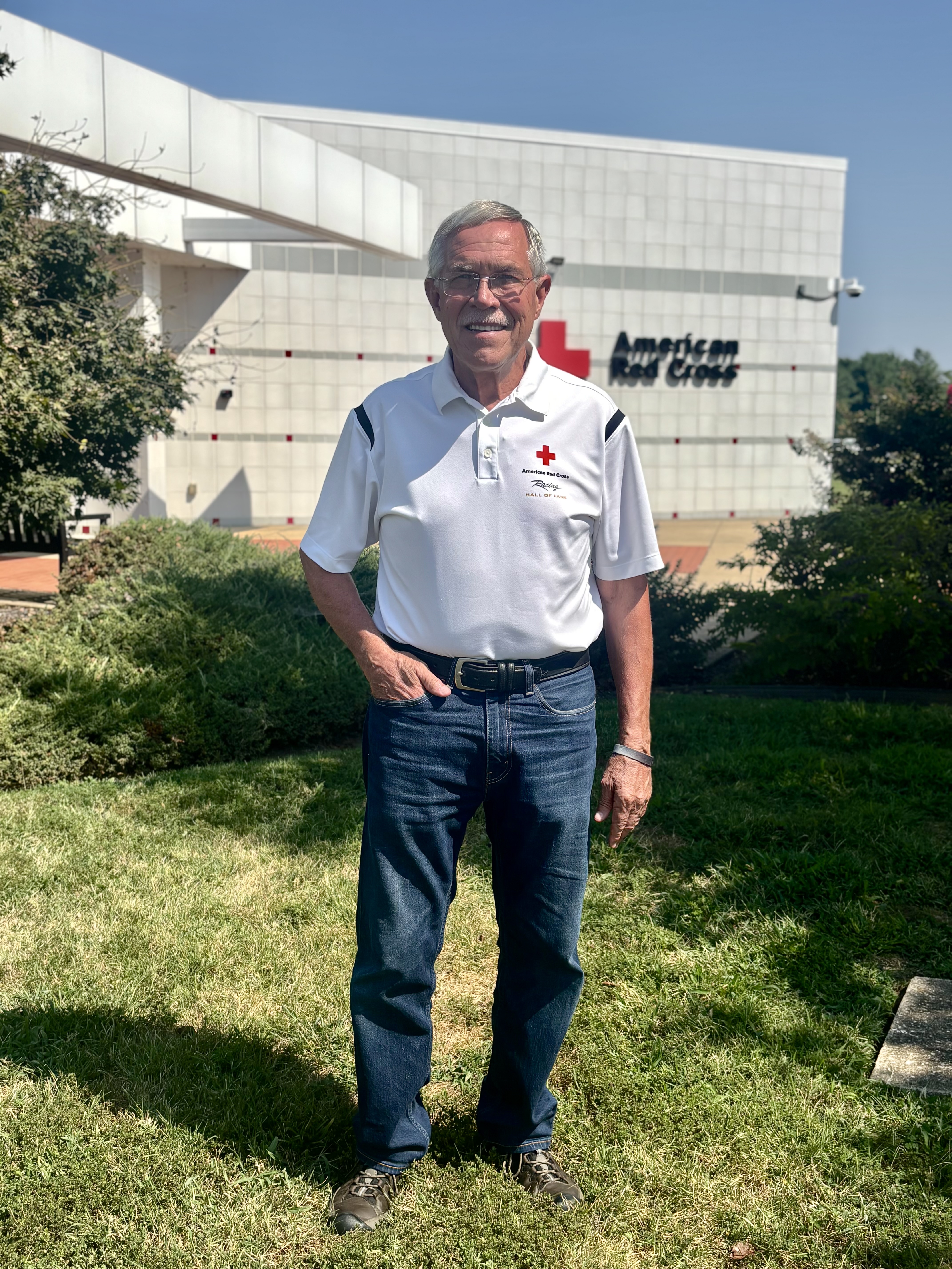 Man standing outside Red Cross building