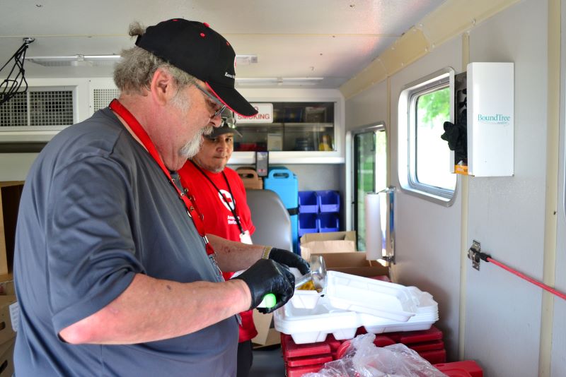  Volunteers Jimmy Lindsay (front) and Ricardo Diaz drove their emergency response vehicle on a mobile feeding route through Tulsa for nearly a week. They would pick up hot food to deliver around lunch, then pick up more to deliver for dinners. Volunteers like Jimmy and Ricardo served more than 15,000 meals during the power outage.