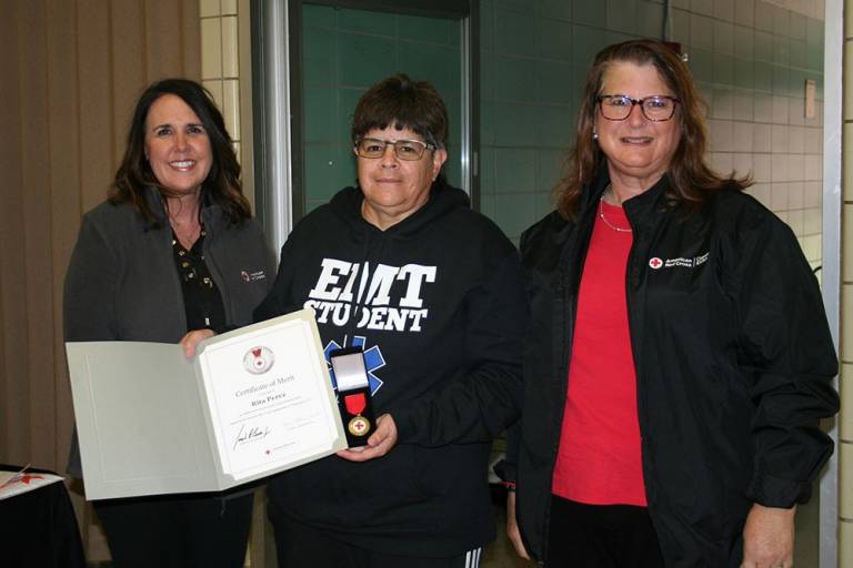 South Central and Southeast Kansas Chapter Executive Director Shannon Wedge presented a Lifesaving Award to Rita Perez.