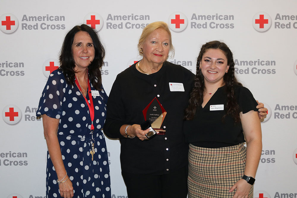 Judith Haffner the 2026 Clara Barton Awar and standing next to Executive Director Shannon Wedge and Community Disaster Program Manager Sara Magnasco.