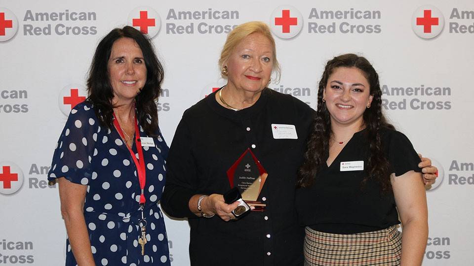 Judith Haffner the 2026 Clara Barton Awar and standing next to Executive Director Shannon Wedge and Community Disaster Program Manager Sara Magnasco.