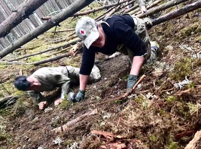 Red Cross SAF Regional Program Manager Amanda English competing in the Spur Ride challenge. She said the Lithuanian solider beside her was cheering her on as best he could, despite a language barrier.