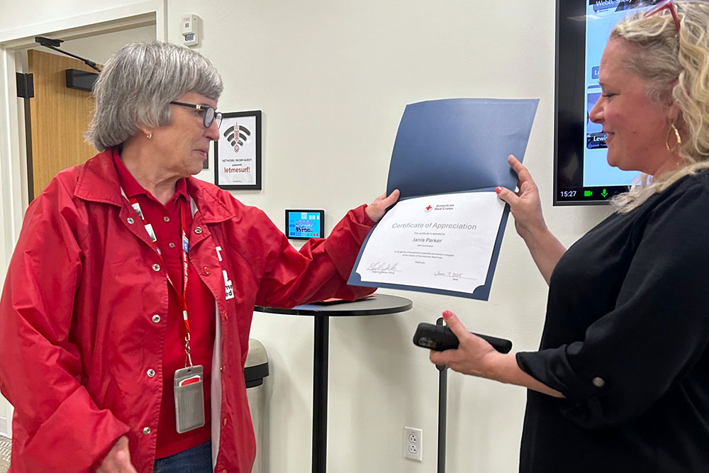 Central and Southwest Oklahoma Volunteer Janis Parker receives a certificate of appreciation from board member Beth Harrison.