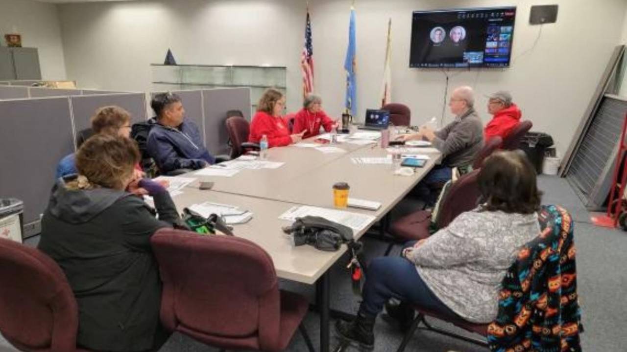 red crossers in meeting