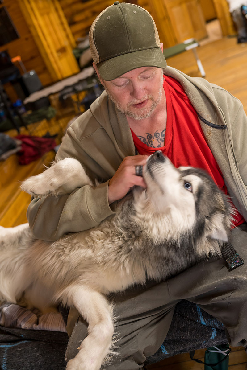 Scotty Gribbins and his dog Nina in a shelter.