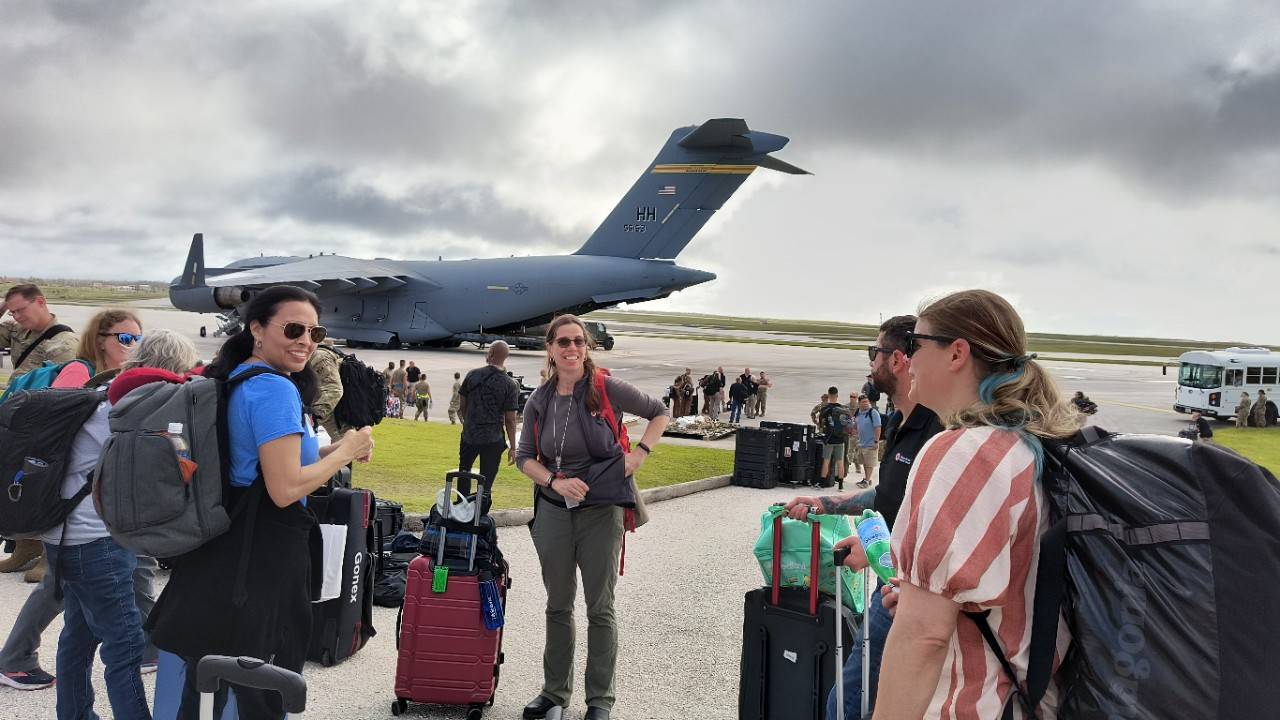 Volunteers leaving on a plane to Guam