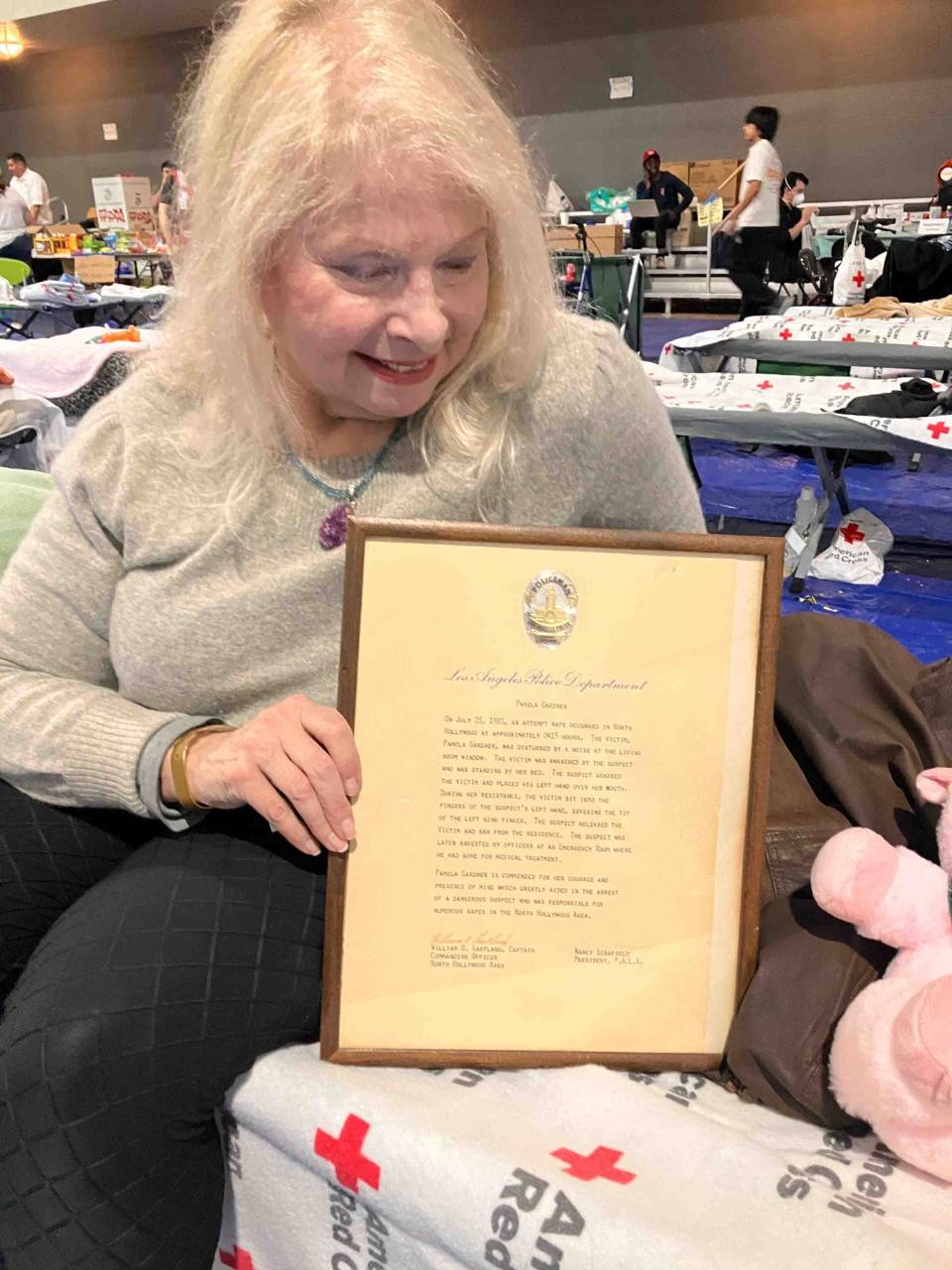Pamela Gardner with her framed commendation from the LAPD