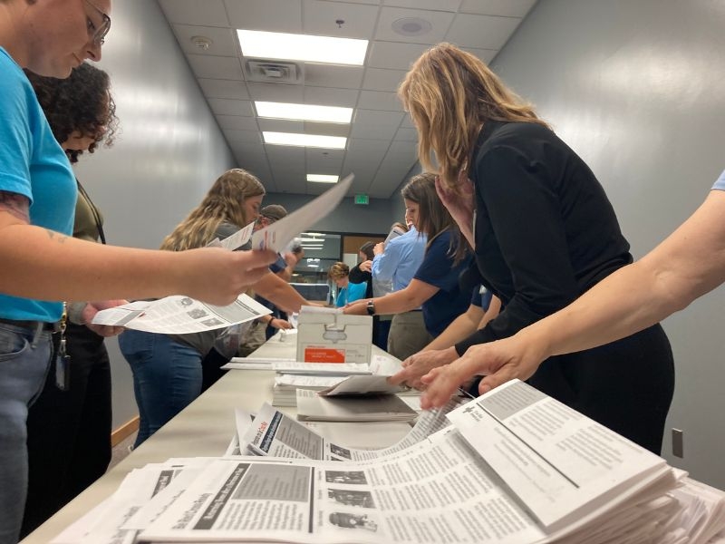 volunteers organizing packets