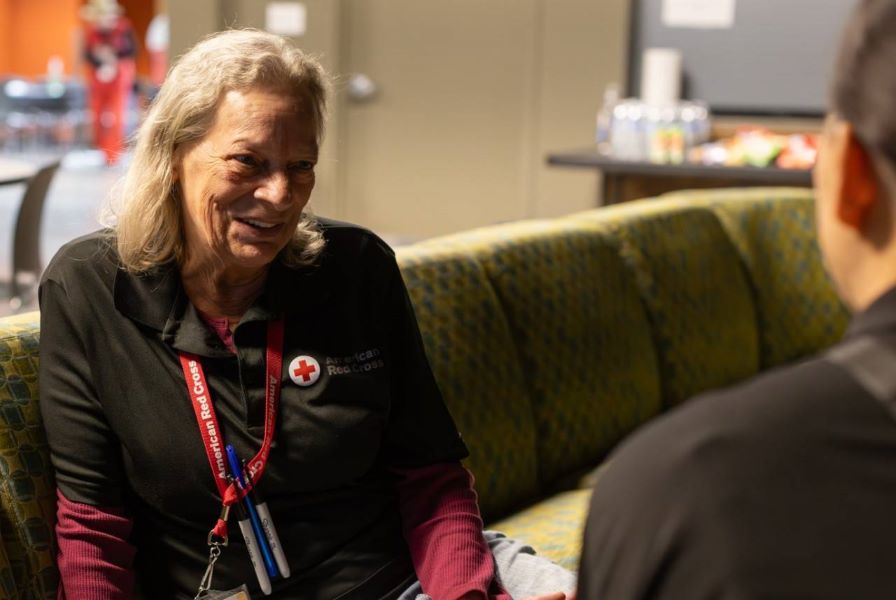 Red Cross volunteer talking to a client.