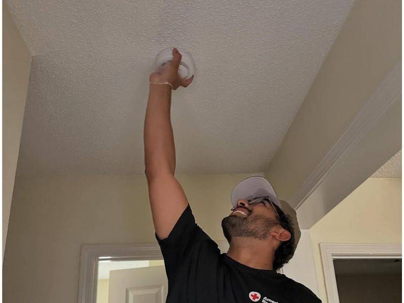 mihir installing smoke alarm