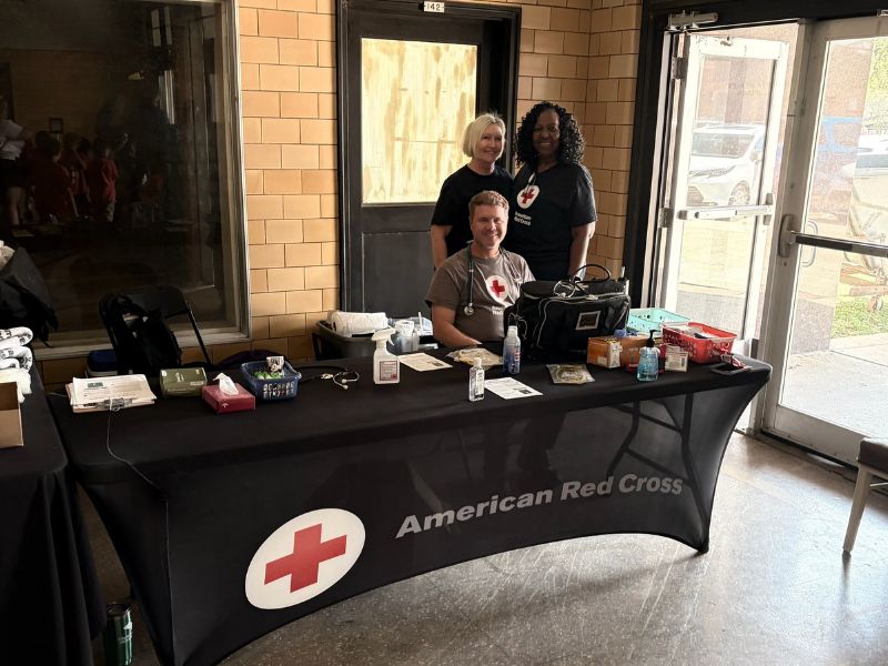 red cross team members outside of exhibit