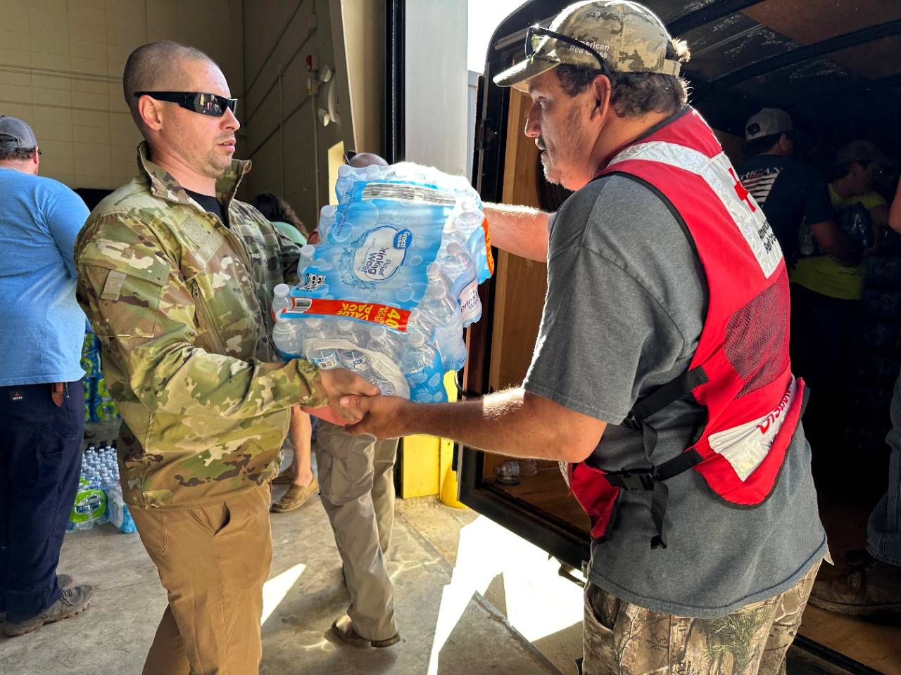 March 25, 2023. Rolling Fork, Mississippi.
First Lt. Jon Gebhardt of the National Guard (acting as a civilian) and American Red Cross volunteer Cliff Boyer load water onto a trailer to deliver to residents of Rolling Fork, Miss. after a string of deadly tornados ripped through the community.
Photo by Haley Correll/American Red Cross