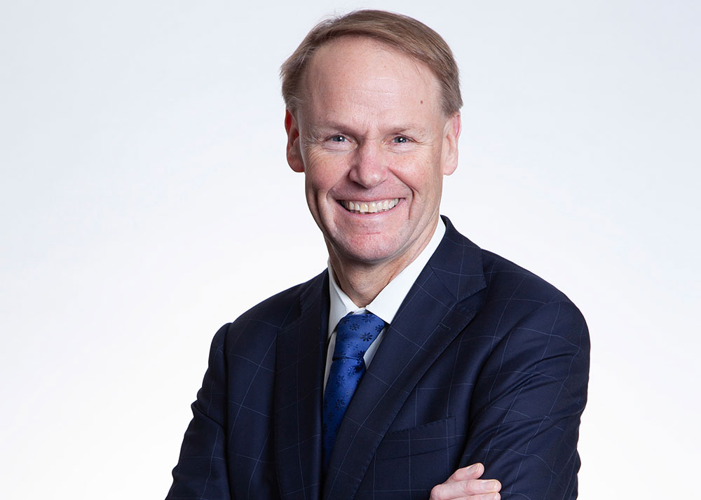 Head shot of Ted Truscott in a suit and tie.