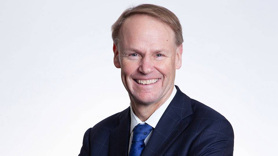 Head shot of Ted Truscott in a suit and tie.