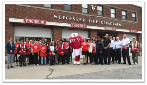 WORCESTER FIRE DEPARTMENT group picture in front of a fire department building.