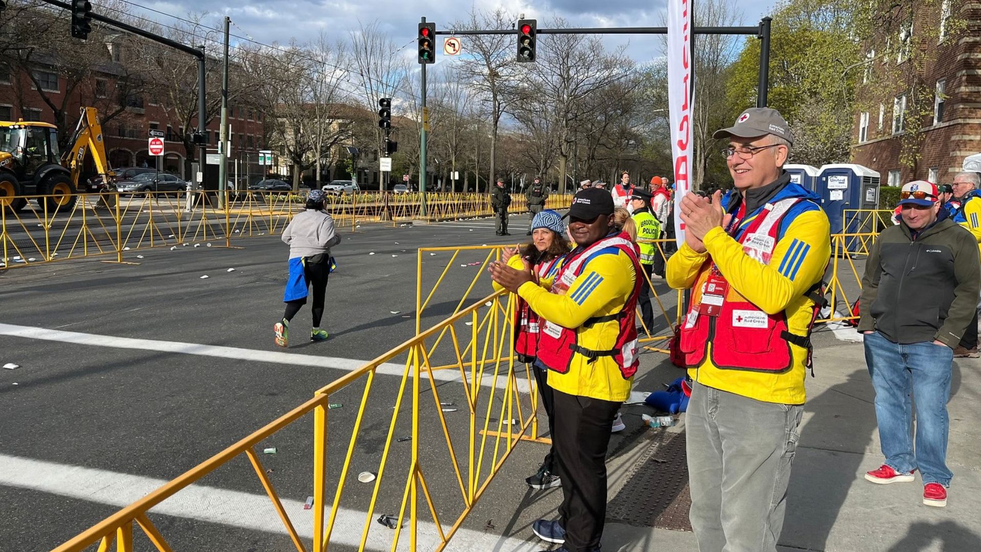people gathered at marathon watching runners