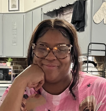 person wearing glasses smiling