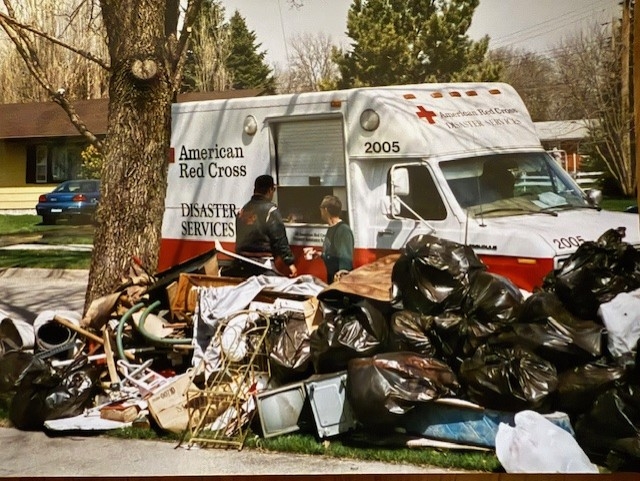 red cross truck with bags outside