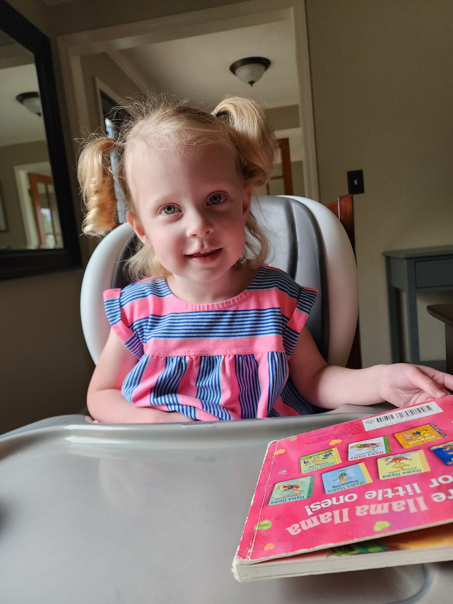 young girl in booster seat