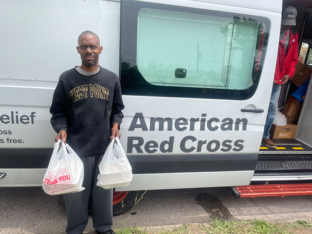 Frank Staten picks up meals from a Red Cross feeding site in his neighborhood.